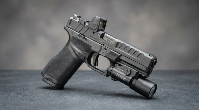 Springfield Armory Echelon pistol with red dot sight and weapon light, showcasing its modular design.