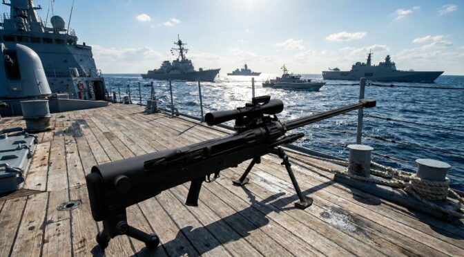 NTW-20 anti-materiel rifle on a ship deck, with naval vessels in the background.