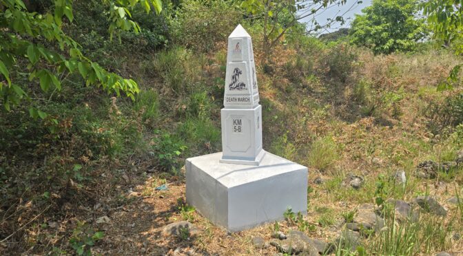Bataan Death March marker, KM 5-B, depicting historical struggle